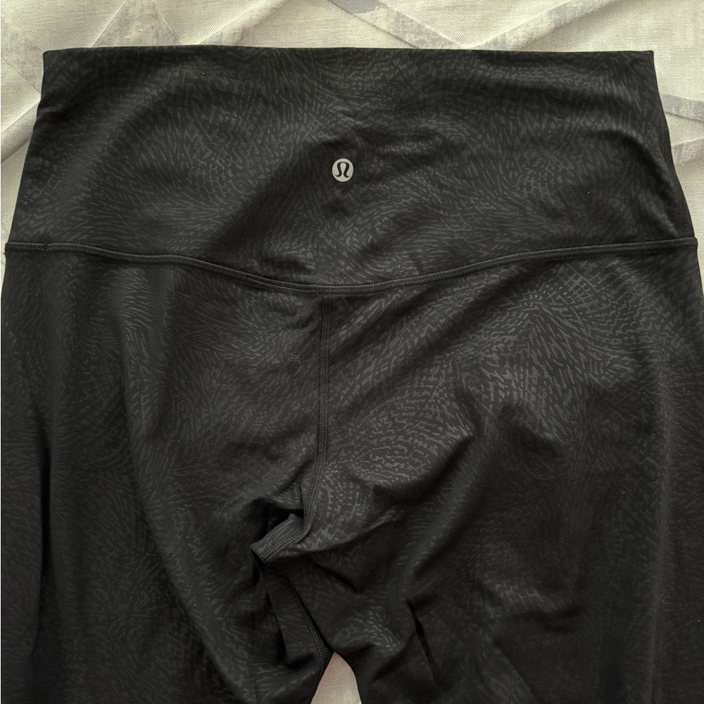 Lululemon Black embossed leggings.  Size 12. Like new.